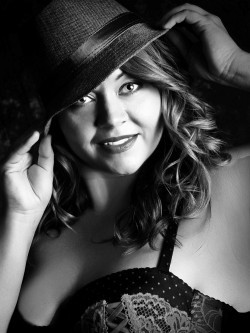 Glamour Shots Boudoir picture of woman wearing hat and lace